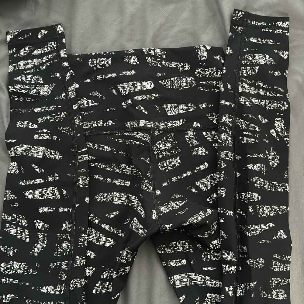 New- without tags. Lululemon full length black and white leggings.